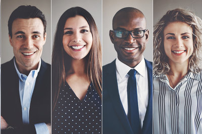 Four smiling professionals in individual portrait panels, diverse in gender and ethnicity, dressed in business attire
