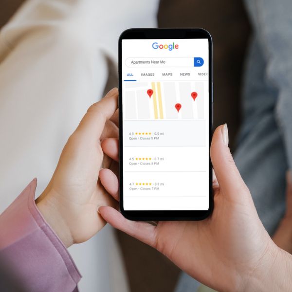 holding phone with maps open