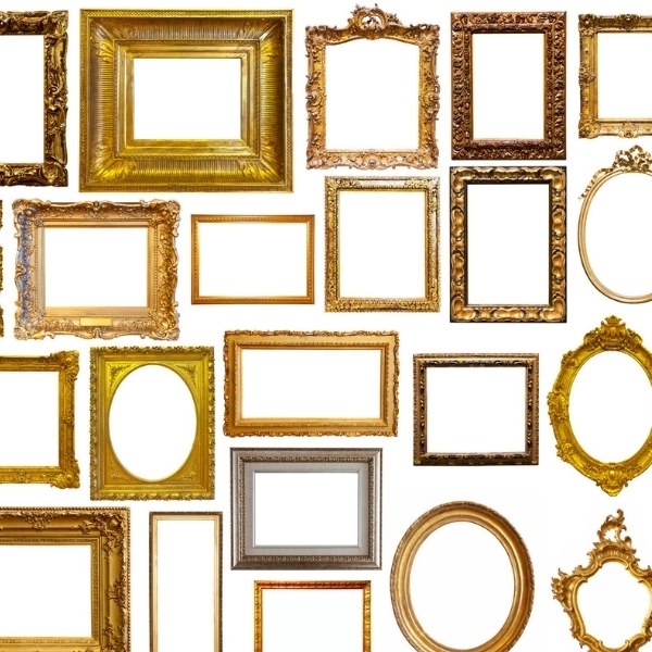 Collection of ornate empty picture frames in gold, silver, and bronze finishes arranged in a grid